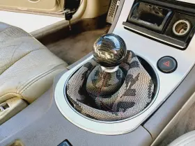 987.in1m07 Infiniti 05-07 G35 Coupe Manual Transmission Shifter Bezel With Aftermarket Bride Boot